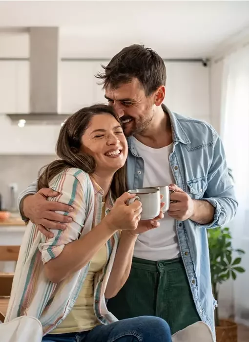 Home Reach homeowners enjoying a drink in their new home